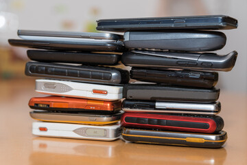 Two Piles With Collected Smartphones And Cell Phones - Closeup