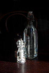 Obraz na płótnie Canvas Salt grinder and water bottle on cafe table, Wellington, New Zealand