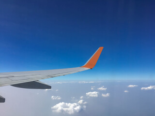 Passenger aircraft clouds cape with white airplane is flying in the daytime sky overcast