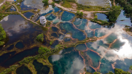 Aerial top down view of beautiful nature abstract crystal clear emarald pool during sunrise