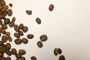 
Coffee Beans isolated pile from top on white background area for copy space. Roasted brown coffee beans, can be used as a background and texture. 