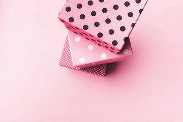 Gift boxs on paste pink background. Christmas and holiday minimal concept idea.