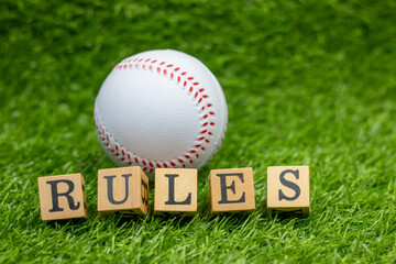 Baseball is on green grass background