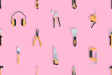 Tools seamless pattern. Various construction tools on a pink background.