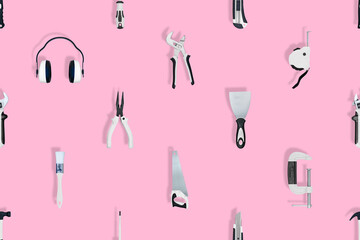 Tools seamless pattern. Various construction tools on a pink background.