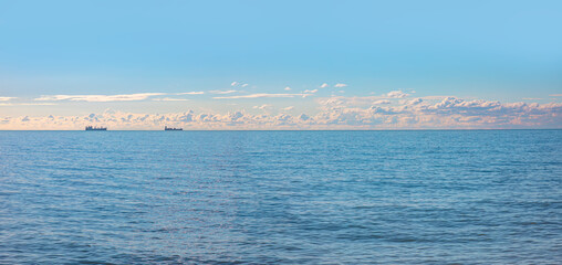 Silhouette of the cargo ships far away