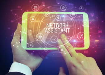 Close-up of a tablet with NETWORK ASSISTANT inscription, innovative technology concept