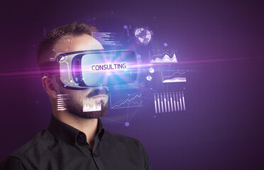 Businessman looking through Virtual Reality glasses with CONSULTING inscription, new business concept