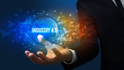 Elegant hand holding INDUSTRY 4.0 inscription, digital technology concept