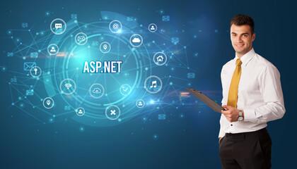 Businessman thinking in front of technology related icons and ASP.NET inscription, modern technology concept