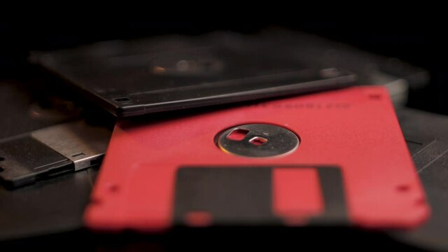 Old Floppy Disks Close Up. Vintage Data Storage Diskettes Spinning Full Frame