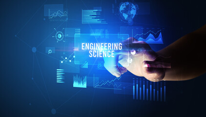 Hand touching ENGINEERING SCIENCE inscription, new business technology concept