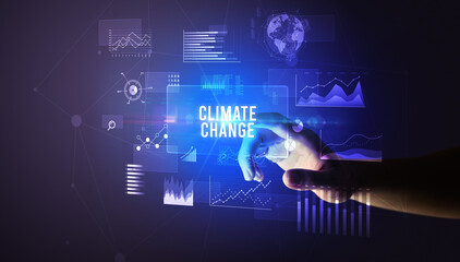 Obraz premium Hand touching CLIMATE CHANGE inscription, new business technology concept