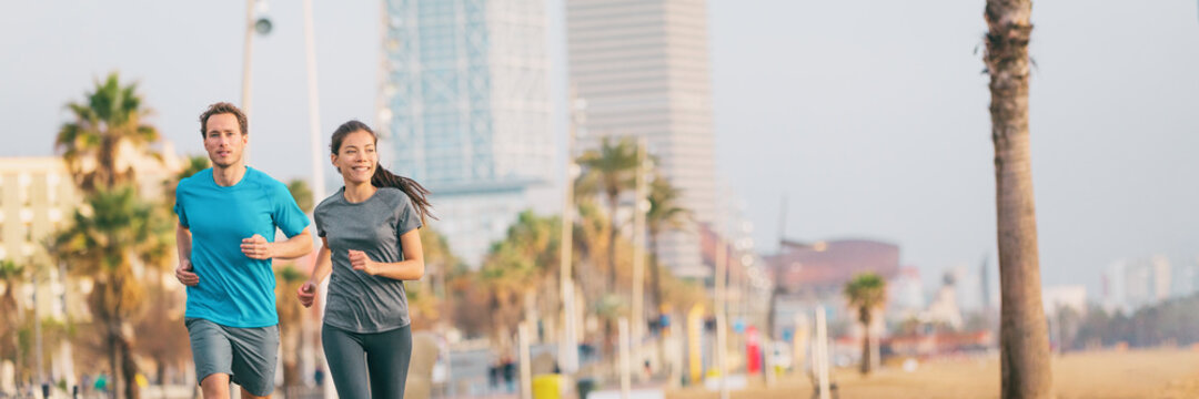 Outdoor Exercise Fit Couple Running Together In Summer City Banner Background. Healthy People Active Lifestyle Runners Exercising Together Panoramic.