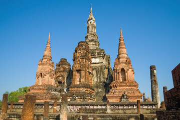 Fototapeta premium On the ancient ruins of the Buddhist temple of Wat Mahatnat. Historical Park of Sukhothai city, Thailand
