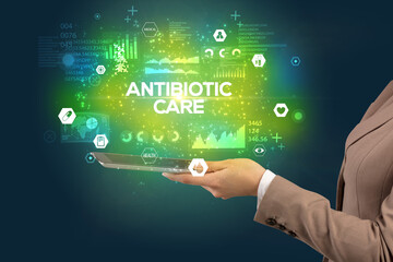Fototapeta na wymiar Close-up of a touchscreen with ANTIBIOTIC CARE inscription, medical concept