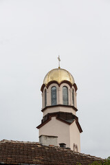 Church bell tower with golden cover