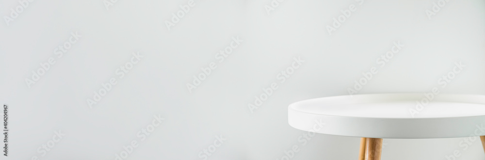 Poster banner empty modern round white table top at white house wall,mockup space background for display or