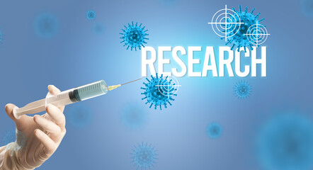 Close-up view of doctor's hand in a white glove holding syringe with RESEARCH inscription, coronavirus antidote concept
