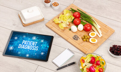PATIENT DIAGNOSIS concept in tablet pc with healthy food around, top view