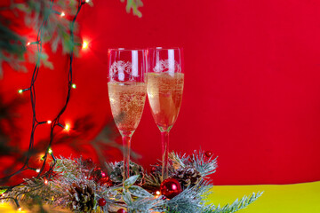 two glasses of champagne on a red background