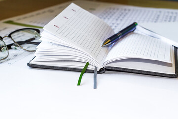 Notepad with pencil and office tools. BUSINESS and finance concept.