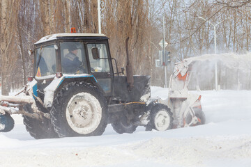 A snowblower works outdoors after a heavy snowfall in Russia.