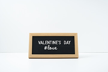 The inscription Valentine's Day in a frame on a white background. Copy space, mock up.