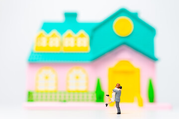 Miniature people , Couple standing together in front of their house, valentines day concept