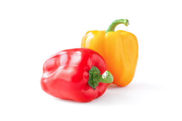Bright ripe yellow and red bell pappers on white background