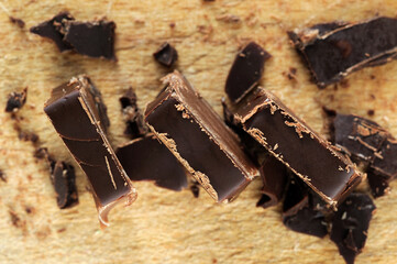 Top view pieces of chocolate candy closeup. Shallow depth of field