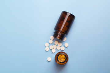 Medicine white pills and glass pills of bottles