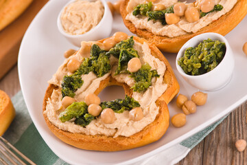 Friselle with turnip tops and hummus.