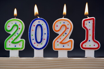 Happy new year 2021 with burning candles.