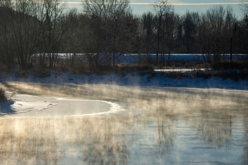 Frozen and fog on the river in the canadian winter