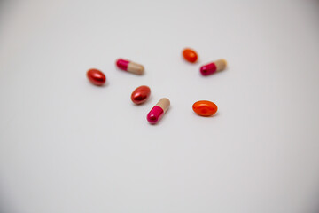Colorful pills isolated on white background with copy space, top view
