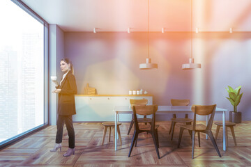 Woman in gray dining room