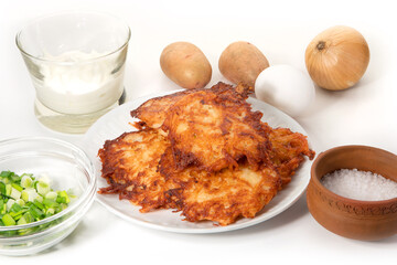 Fried potato pancakes on the white background