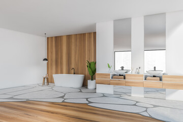 White and wooden bathroom with bathtub and sinks near window