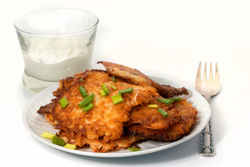 Fried potato pancakes on the white background