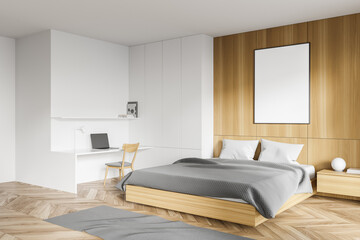 White and wooden bedroom corner with home office and poster