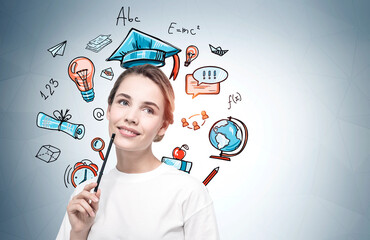 Young woman with pencil and education sketch