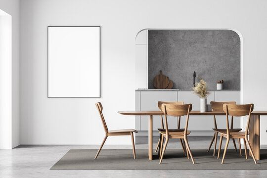Modern white kitchen with table and poster