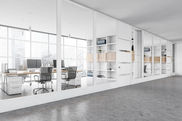 White office room with chairs and table behind glass windows