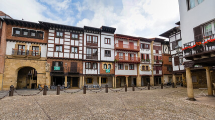 Fototapeta na wymiar Plaza de Hondarribia, traditional houses and balconies with flowers in the Basque Country. 