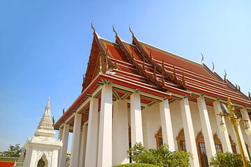 Naklejka premium Gorgeous Ordinary Hall of Wat Ratchanatdaram Temple against Sunny Blue Sky, Bangkok Old City, Thailand