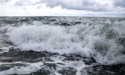 Wave in the sea with splashing water.