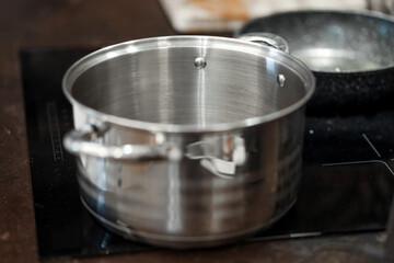 A saucepan on an electric stove in the kitchen close-up.