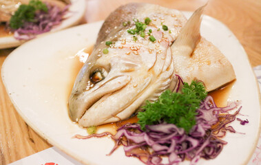 boiled Salmon head Japanese style on white plate