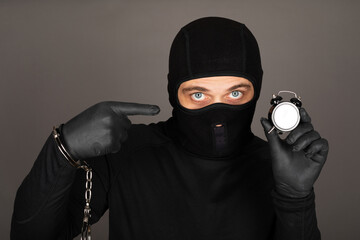 Man with black mask with handcuffs